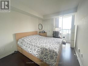 Toronto (Willowdale East) condo for rent - A bedroom with a bed, dresser, and window.