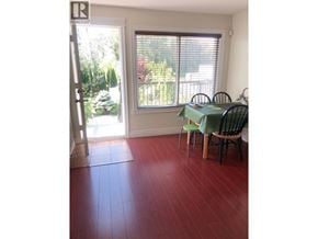 Burnaby apartment for rent - A room with a table and chairs and a window.