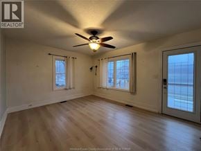 Chatham apartment for rent - A room with a ceiling fan and two windows.