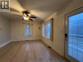 Chatham apartment for rent - A room with a ceiling fan and wooden flooring.