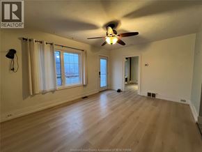 Chatham apartment for rent - A room with a ceiling fan and a window with curtains.