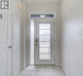 Brant (Paris) apartment for rent - A white door with a glass window is in a white hallway.