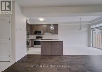 Brant (Paris) apartment for rent - A kitchen with a brown countertop and cabinets.