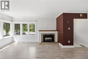 Hamilton apartment for rent - A living room with a fireplace and a large window.
