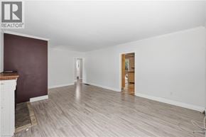 Hamilton apartment for rent - A room with a wooden floor and a fireplace.