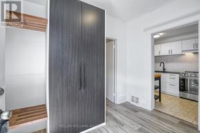 Toronto (Cabbagetown-South St. James Town) apartment for rent - A modern kitchen with a wooden floor and white walls.