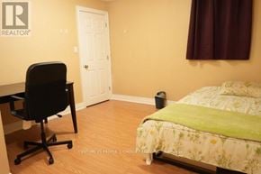 Mississauga (Creditview) apartment for rent - A bedroom with a bed, desk, and chair.