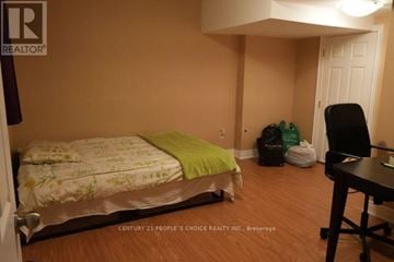 Mississauga (Creditview) apartment for rent - A bedroom with a bed, chair, and desk.
