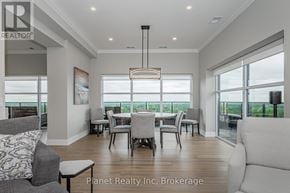 Guelph (Pineridge/Westminster Woods) condo for rent - A well-lit, spacious living room with a dining area in the background.