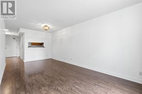 Toronto (Church-Yonge Corridor) condo for rent - A room with wooden flooring and white walls, with a light fixture on the ceiling.