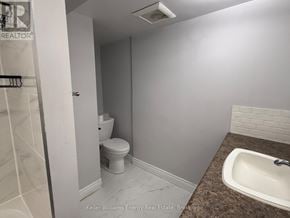 Oshawa (Donevan) apartment for rent - A small bathroom with a toilet and sink.