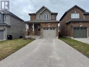 Barrie (Painswick South) apartment for rent - A large, two-story house with a driveway in front.