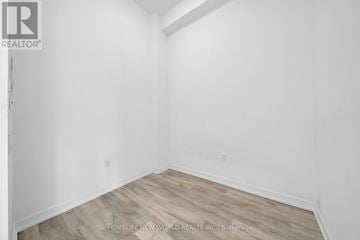 Toronto (Newtonbrook East) condo for rent - A black and white floor plan of an apartment with a living room, dining/kitchen area, den, bedroom, bathroom, and en suite.