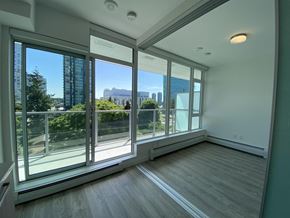 Surrey apartment for rent - A room with a view of the city through large windows.