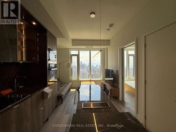 Toronto (Annex) condo for rent - A modern kitchen with a view of the city.