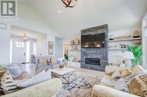 Kawartha Lakes (Manvers) apartment for rent - A living room with a fireplace and a chandelier.