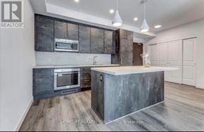 Niagara Falls (Brown) condo for rent - A modern kitchen with a concrete island and a built-in oven.