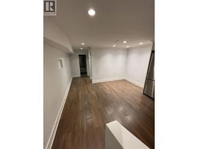 Vancouver apartment for rent - A hallway with wooden floors and white walls.