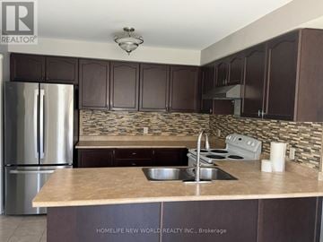 Oshawa (Pinecrest) apartment for rent - A kitchen with a refrigerator, sink, and countertop.