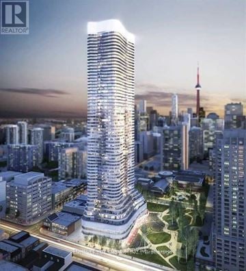 Toronto (Bay Street Corridor) condo for rent - A tall, modern skyscraper with a glass facade is the focal point of a cityscape.