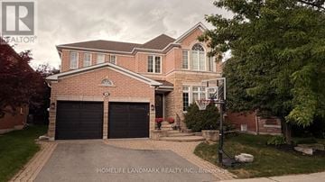 Aurora (Aurora Highlands) apartment for rent - A large brick house with a basketball hoop in front.