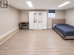 Mississauga (Erin Mills) apartment for rent - A bedroom with a bed, desk, and chair.