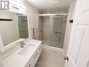 Mississauga (Erin Mills) apartment for rent - A white bathroom with a walk in shower.
