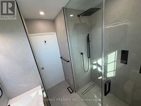 Toronto (Brookhaven-Amesbury) apartment for rent - A bathroom with a walk-in shower and a white door.