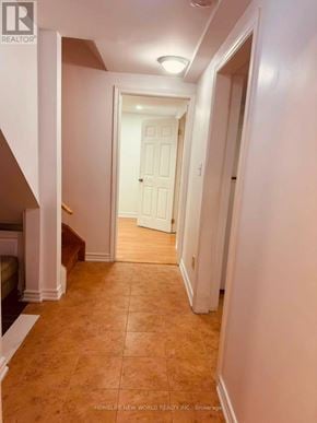Mississauga (Cooksville) townhouse for rent - A hallway with a white door and tiled floor.