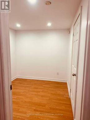 Mississauga (Cooksville) townhouse for rent - A hallway with wooden floors and white walls.