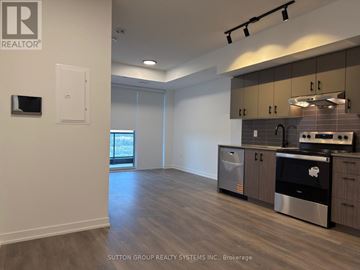 Burlington (Alton) condo for rent - A kitchen area with a stove top oven and a microwave.