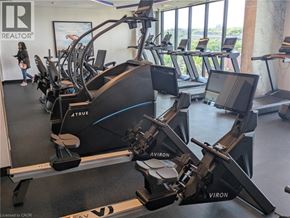 Hamilton condo for rent - A gym with treadmills and a woman walking by.