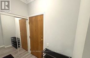 Toronto (Church-Yonge Corridor) condo for rent - A room with a wooden door and a white wall.