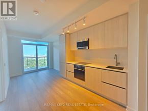 Toronto (Mount Pleasant West) condo for rent - A modern kitchen with wooden cabinets and a stainless steel sink.