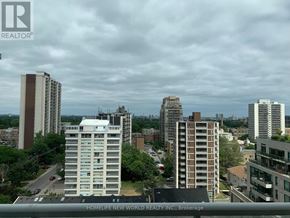 Toronto (Mount Pleasant West) condo for rent - A cityscape with buildings and a cloudy sky.