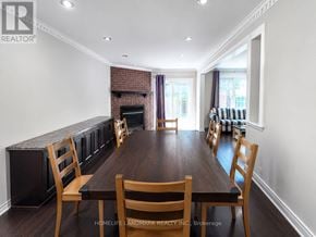 Markham (Middlefield) apartment for rent - A dining room with a wooden table and chairs.