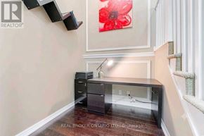 Mississauga (City Centre) condo for rent - A room with a desk and a cat tree.