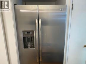 West Vancouver apartment for rent - A stainless steel refrigerator with a water and ice dispenser built into the door.