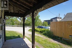 South Bruce Peninsula duplex for rent - A porch with a sign that says REALTOR.