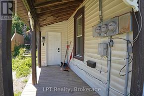 South Bruce Peninsula duplex for rent - A white door is on the left side of a house.