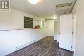 South Bruce Peninsula multi-family for rent - A room with a white door and a window with blinds.