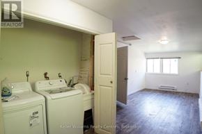 South Bruce Peninsula multi-family for rent - A laundry room with a washer and dryer.