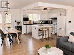 Petawawa apartment for rent - A modern kitchen with a dining table and chairs.