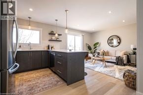 Hamilton apartment for rent - A modern kitchen with dark wood cabinets and a large island.