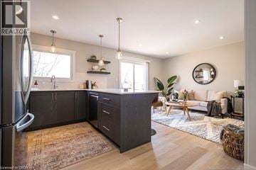 Hamilton apartment for rent - A modern kitchen with dark wood cabinets and a large island.