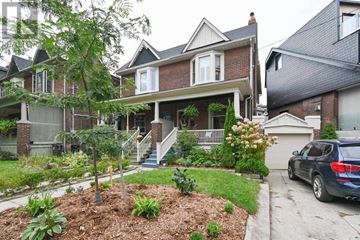Toronto (The Beaches) apartment for rent - A house with a car parked in front.