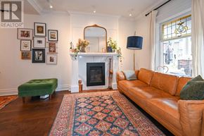 Toronto (The Beaches) apartment for rent - A living room with a fireplace and a couch.