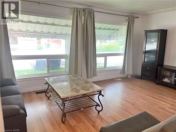 Waterloo apartment for rent - A living room with a marble coffee table and a grey sofa.