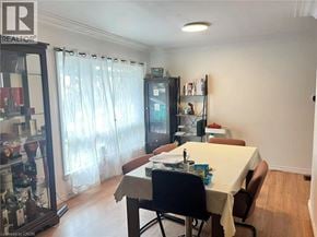 Waterloo apartment for rent - A dining room with a table set for two and a wine cooler.