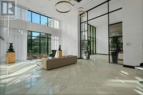 Ottawa condo for rent - A spacious lobby with a white marble floor and modern furniture.